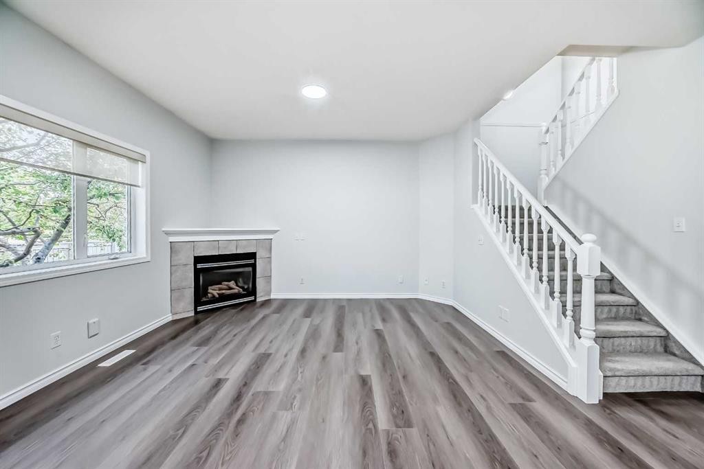 92 Simcoe Place Sw, Calgary, AB - Indoor With Fireplace
