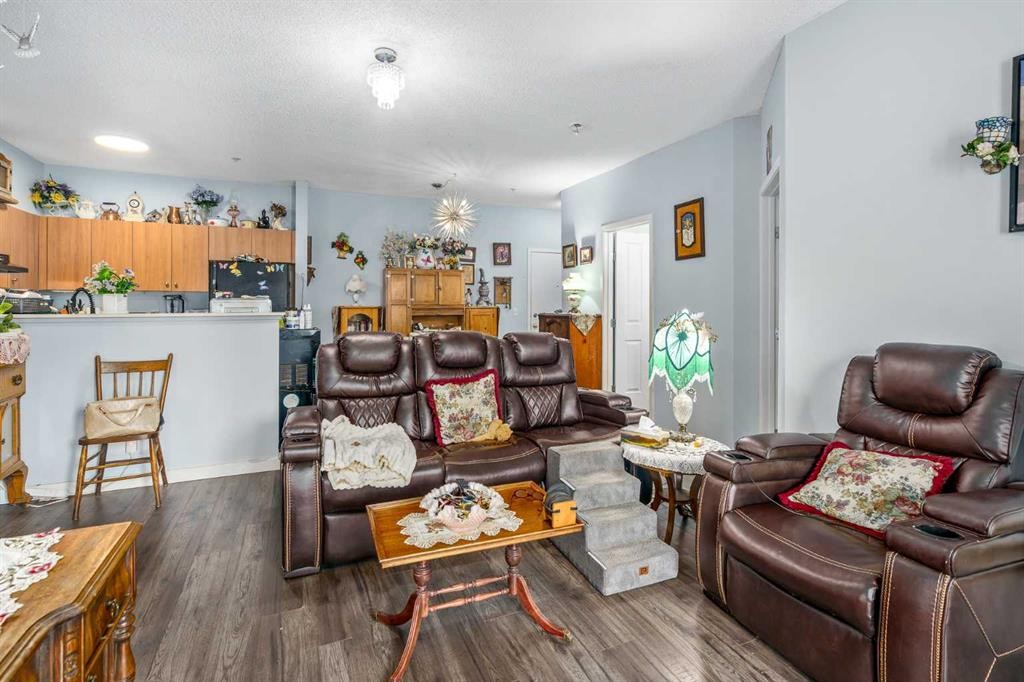 1116-1140 Taradale Drive Ne, Calgary, AB - Indoor Photo Showing Living Room
