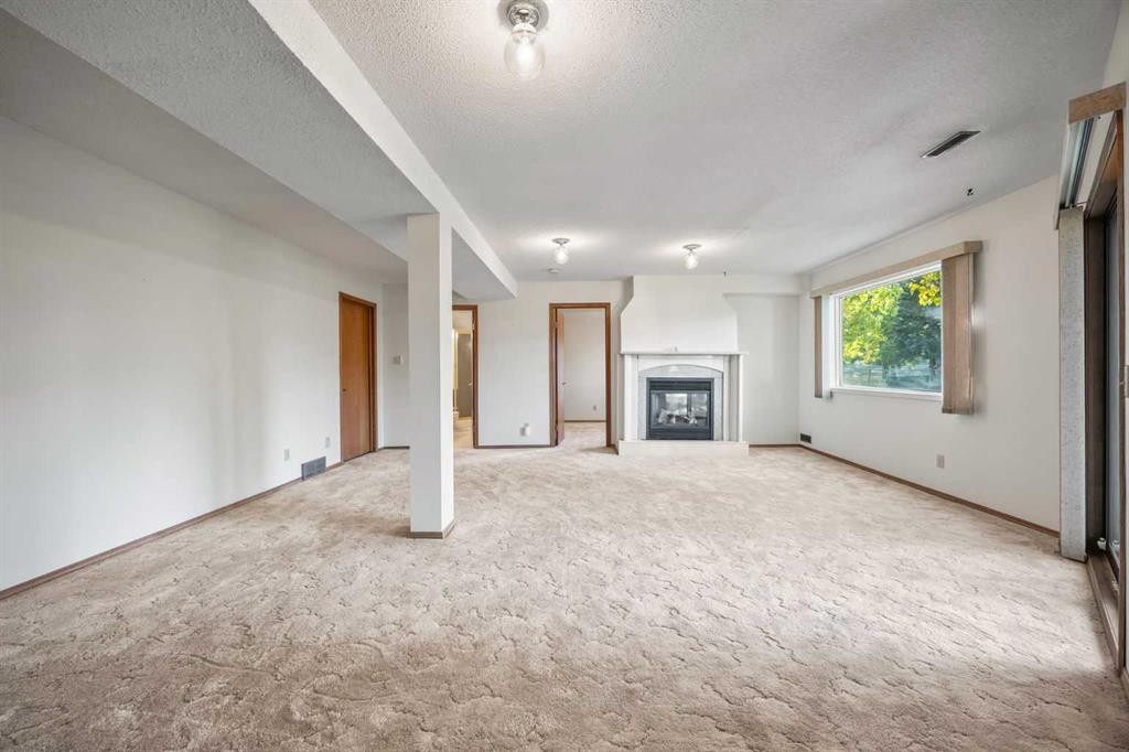 52 Sandarac Circle Nw, Calgary, AB - Indoor With Fireplace