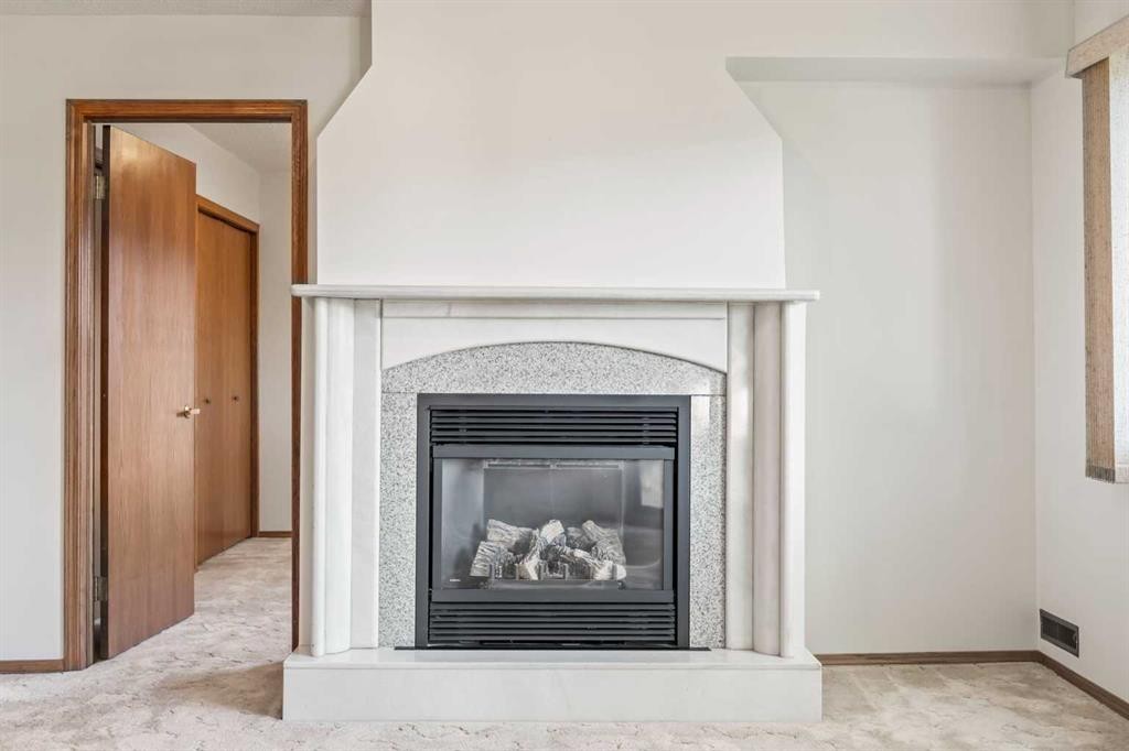 52 Sandarac Circle Nw, Calgary, AB - Indoor Photo Showing Living Room With Fireplace
