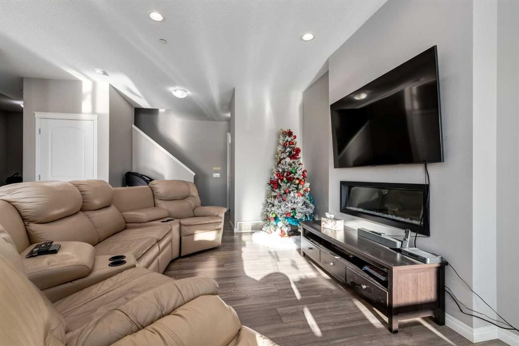 82 Howse Common Ne, Calgary, AB - Indoor Photo Showing Living Room With Fireplace