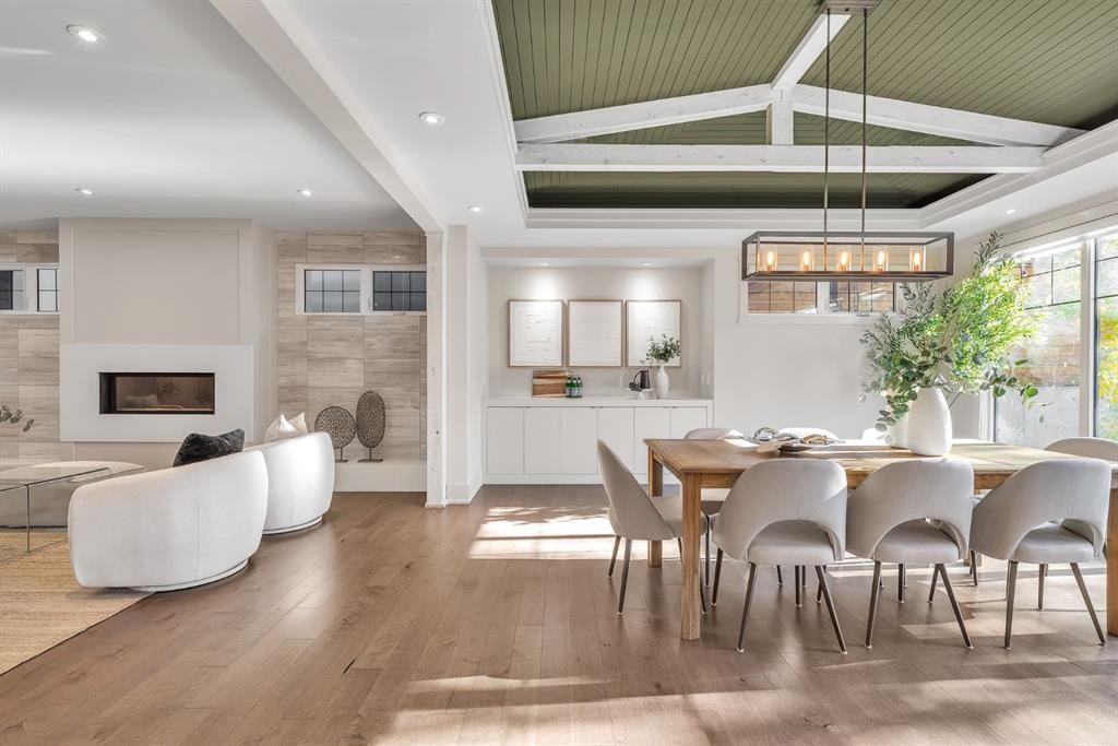 625 Britannia Drive Sw, Calgary, AB - Indoor Photo Showing Dining Room With Fireplace