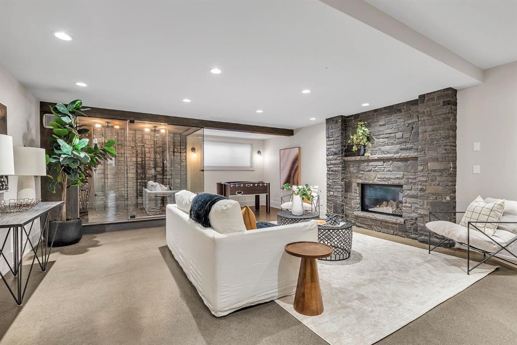 625 Britannia Drive Sw, Calgary, AB - Indoor Photo Showing Living Room With Fireplace