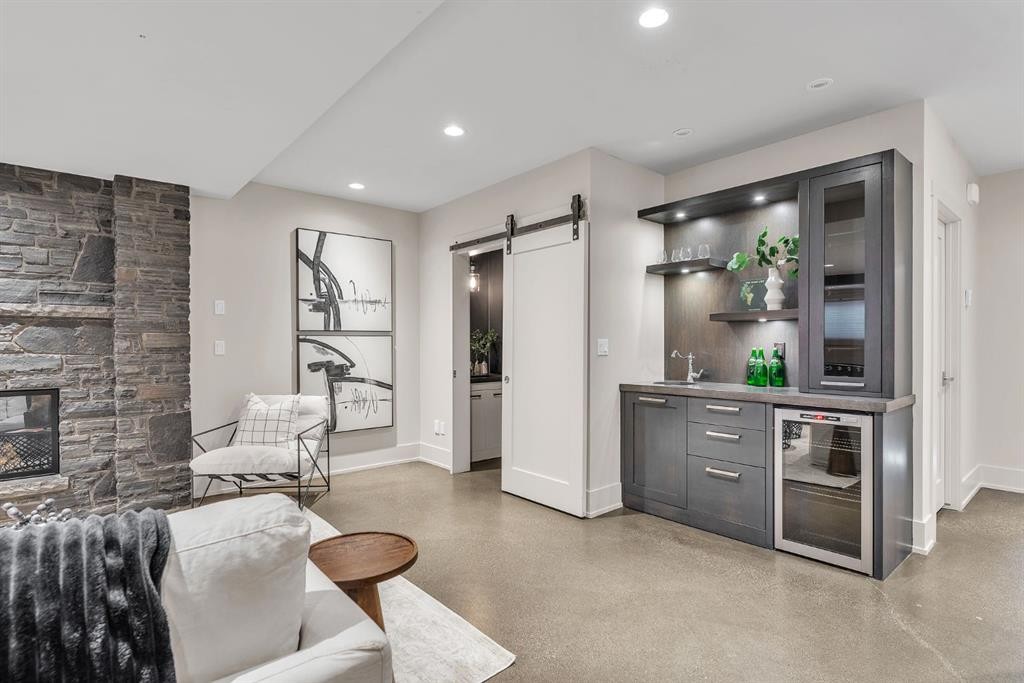625 Britannia Drive Sw, Calgary, AB - Indoor Photo Showing Living Room With Fireplace