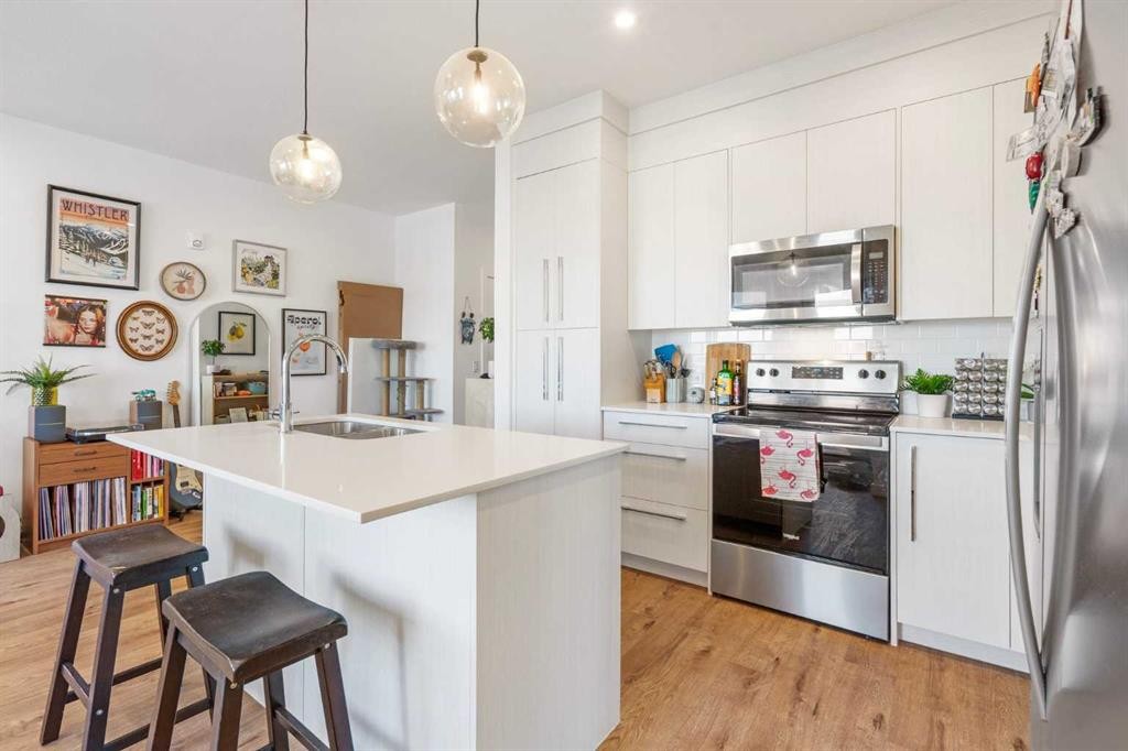 2415-681 Savanna Boulevard Ne, Calgary, AB - Indoor Photo Showing Kitchen With Stainless Steel Kitchen With Double Sink