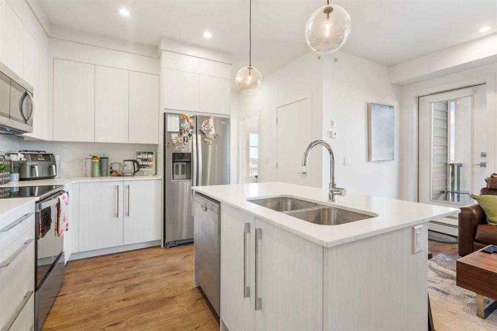 2415-681 Savanna Boulevard Ne, Calgary, AB - Indoor Photo Showing Kitchen With Double Sink With Upgraded Kitchen
