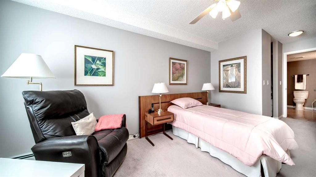 2206-7451 Springbank Boulevard Sw, Calgary, AB - Indoor Photo Showing Bedroom
