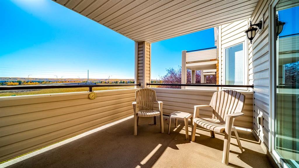 2206-7451 Springbank Boulevard Sw, Calgary, AB - Outdoor With Deck Patio Veranda With Exterior
