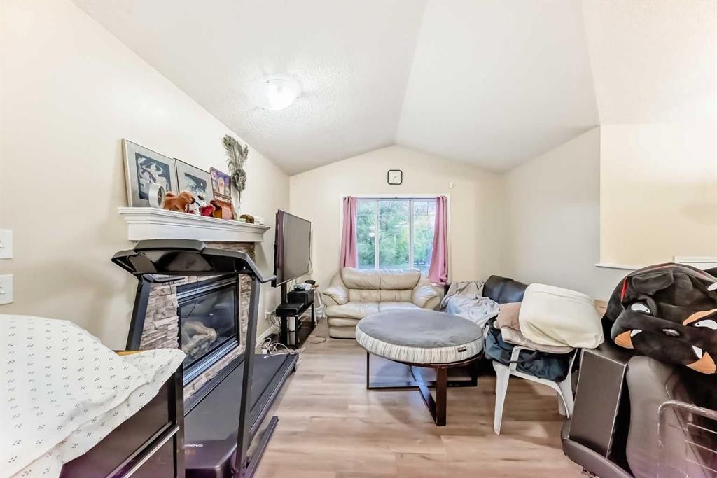 10 Saddlebrook Gardens Ne, Calgary, AB - Indoor Photo Showing Living Room With Fireplace