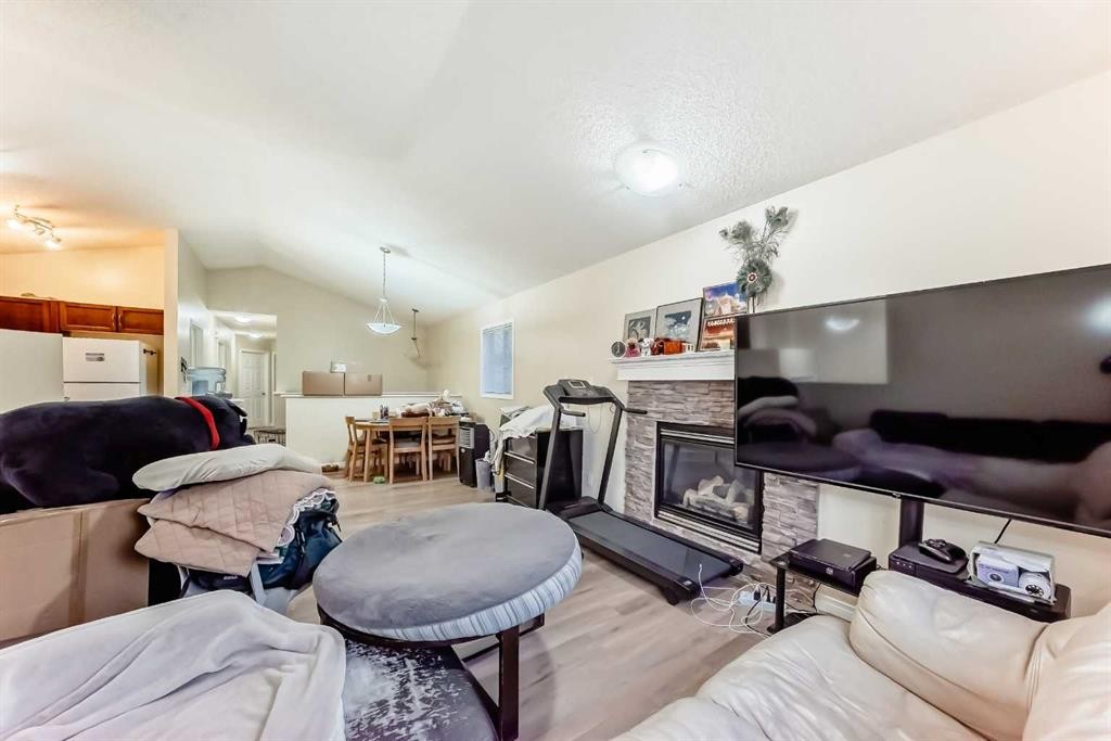 10 Saddlebrook Gardens Ne, Calgary, AB - Indoor Photo Showing Living Room With Fireplace