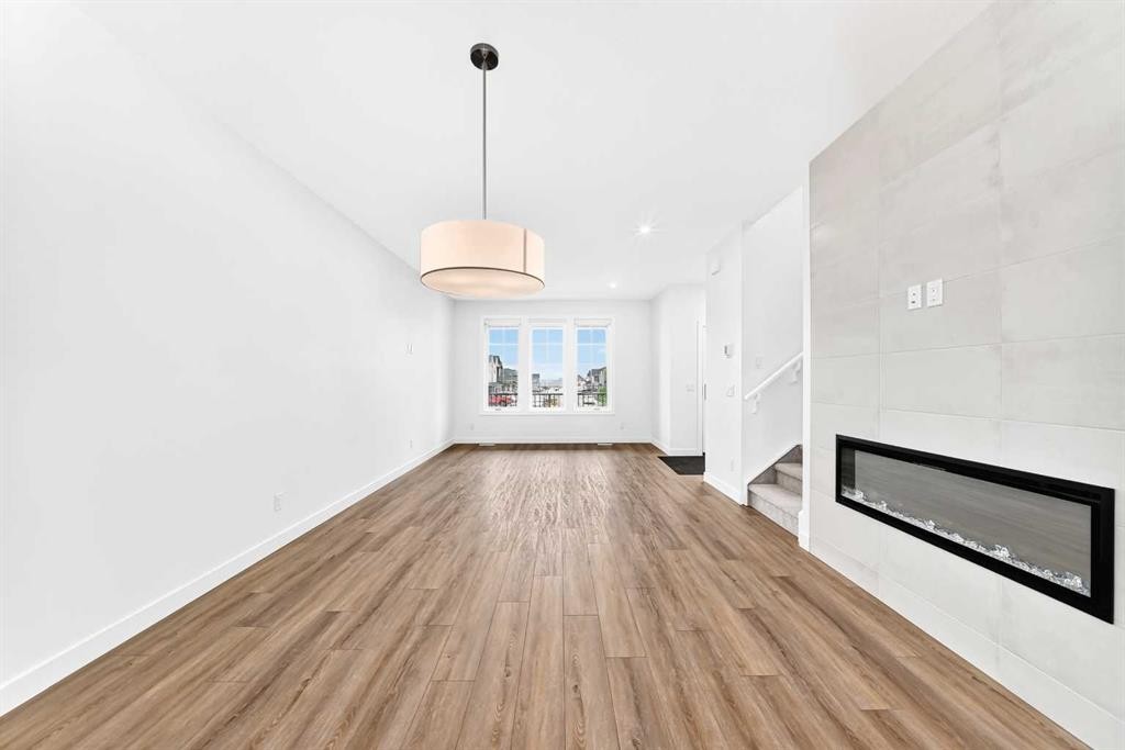 5005 Harmony Circle, Rural Rocky View County, AB - Indoor With Fireplace