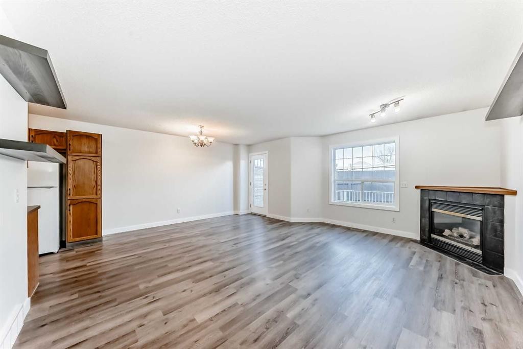 184 Mt Aberdeen Manor Se, Calgary, AB - Indoor Photo Showing Living Room With Fireplace