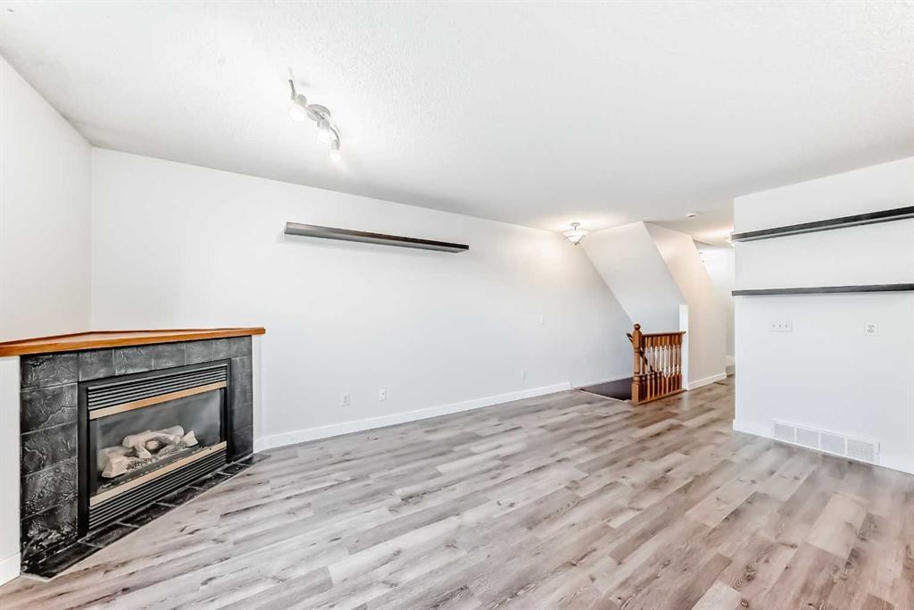 184 Mt Aberdeen Manor Se, Calgary, AB - Indoor Photo Showing Living Room With Fireplace