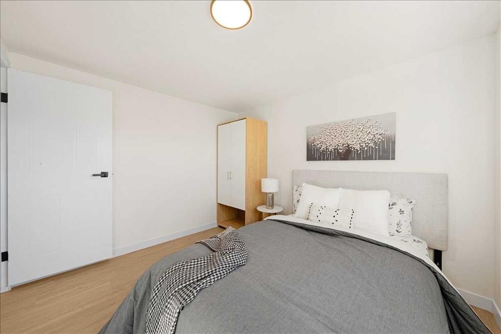 210 Erin Woods Circle Se, Calgary, AB - Indoor Photo Showing Bedroom