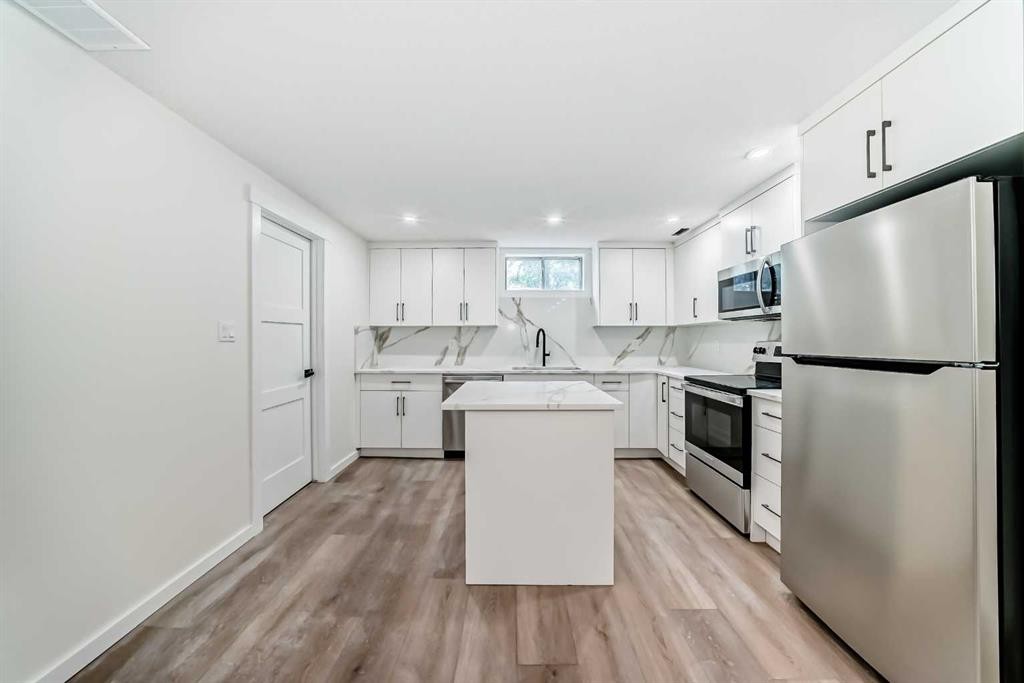 64 Woodstock Road Sw, Calgary, AB - Indoor Photo Showing Kitchen With Stainless Steel Kitchen