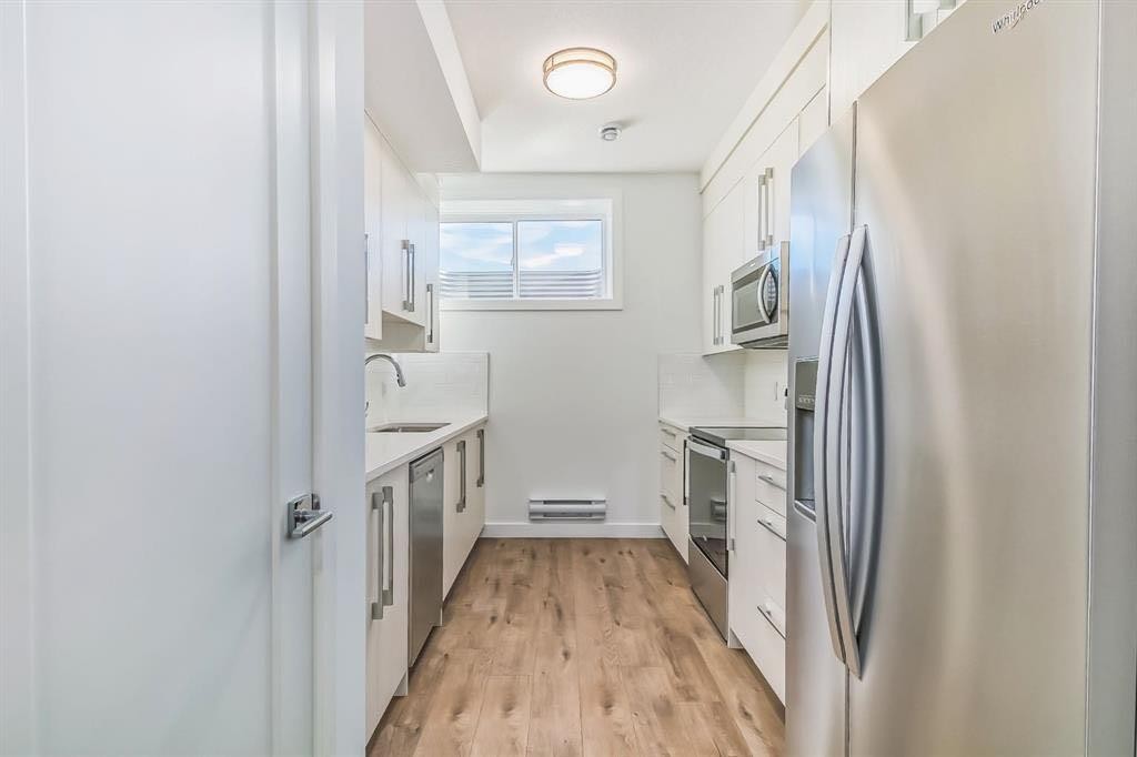 7654 202 Avenue Se, Calgary, AB - Indoor Photo Showing Kitchen With Upgraded Kitchen