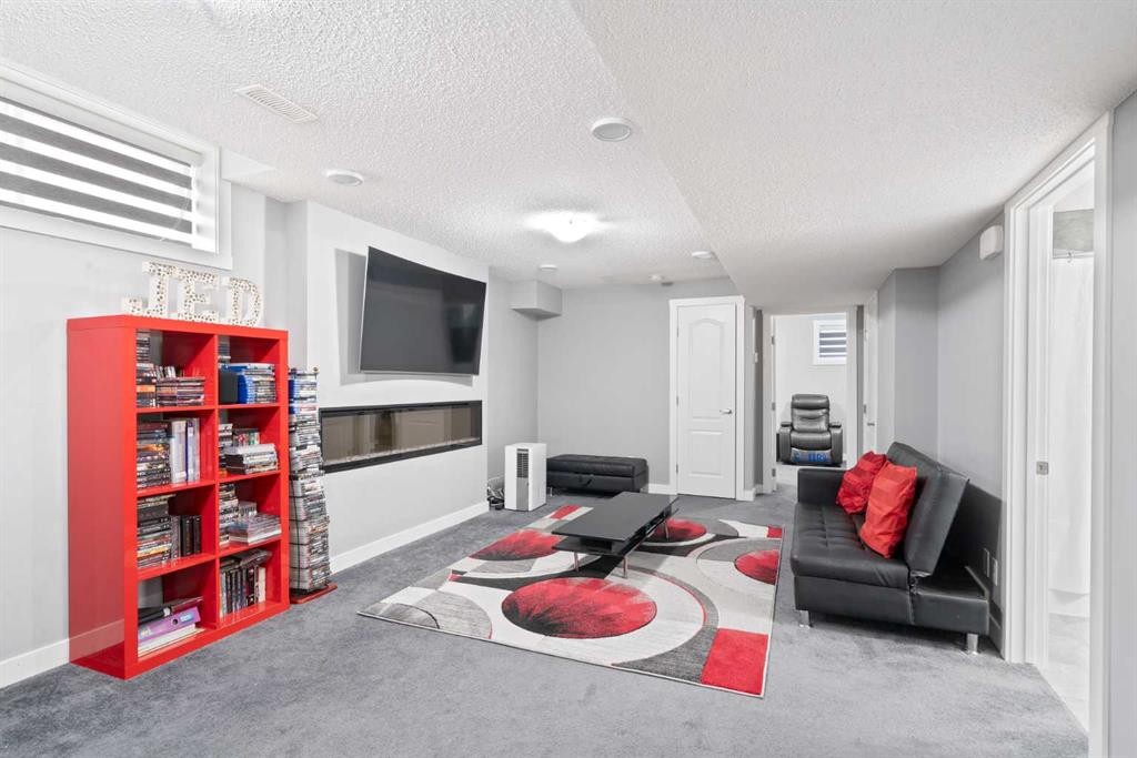 40 Cornerstone Avenue Ne, Calgary, AB - Indoor Photo Showing Other Room With Fireplace