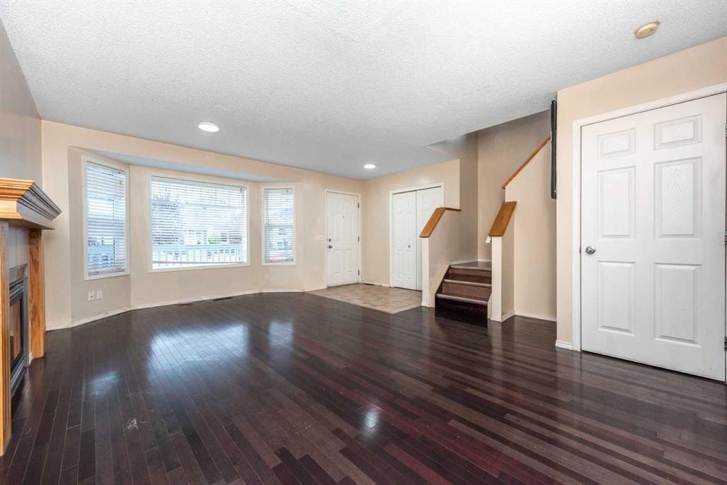 171 Tarawood Road Ne, Calgary, AB - Indoor Photo Showing Other Room With Fireplace