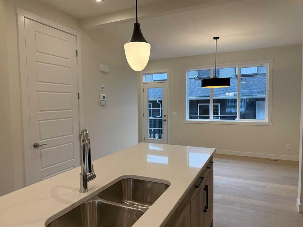 334 Sundown Road, Cochrane, AB - Indoor Photo Showing Kitchen With Double Sink