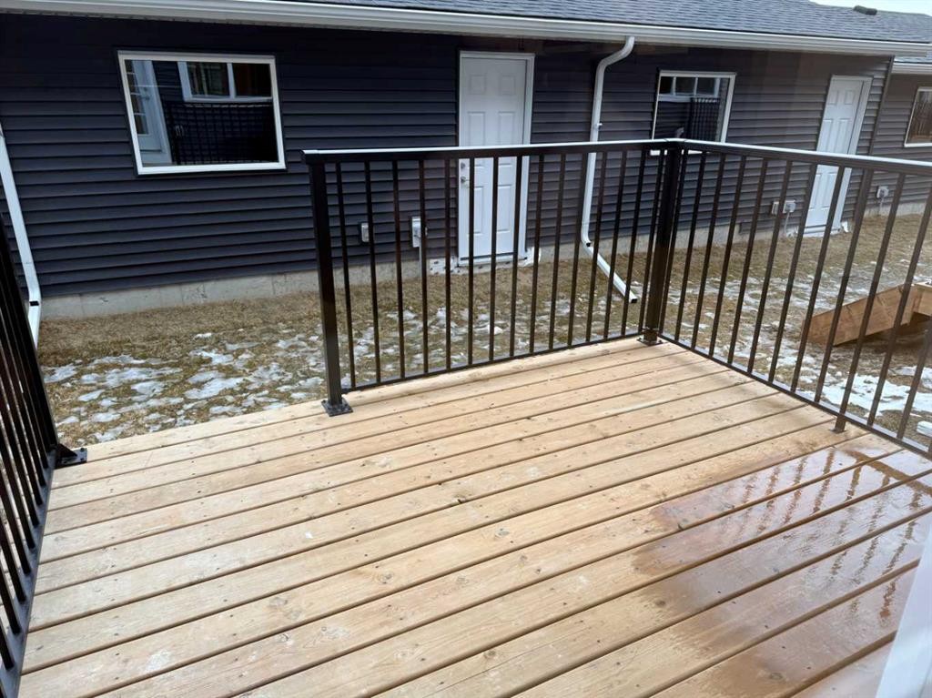 334 Sundown Road, Cochrane, AB - Outdoor With Deck Patio Veranda With Exterior
