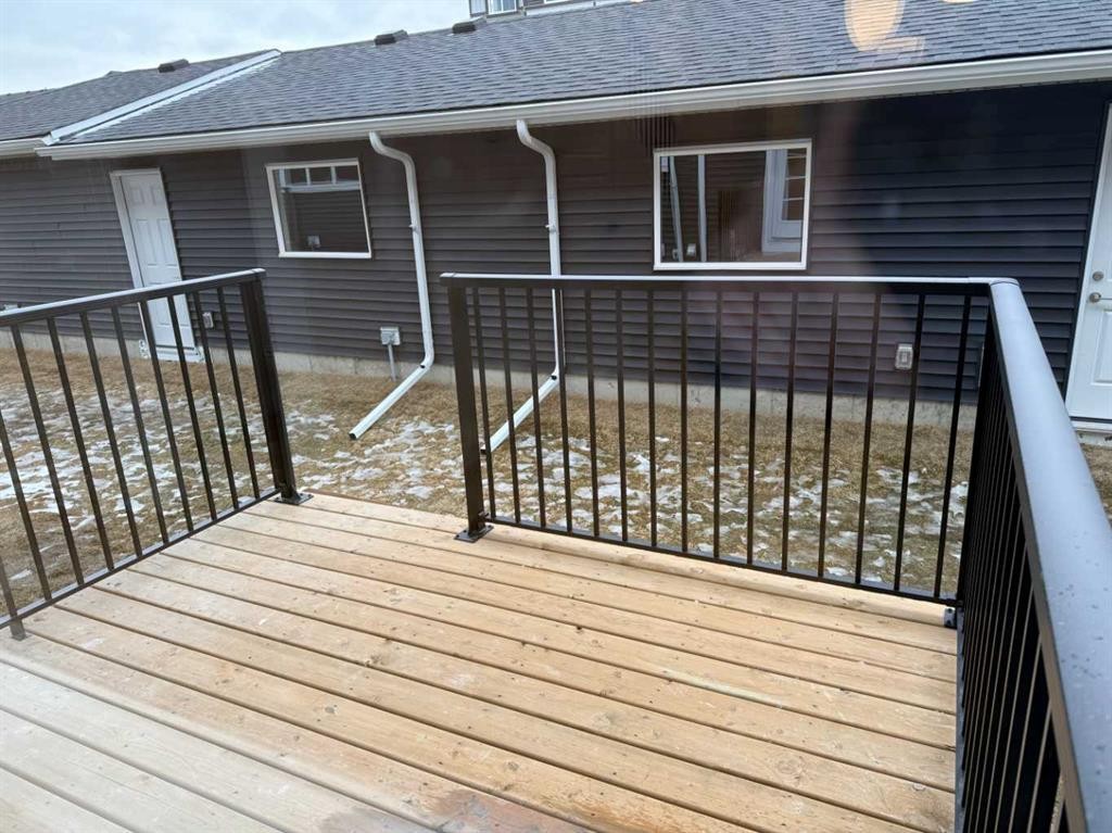 334 Sundown Road, Cochrane, AB - Outdoor With Deck Patio Veranda With Exterior