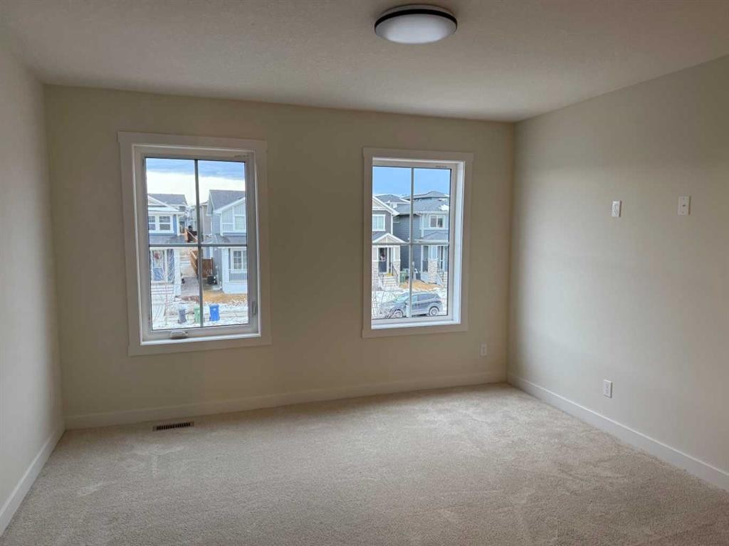 334 Sundown Road, Cochrane, AB - Indoor Photo Showing Other Room