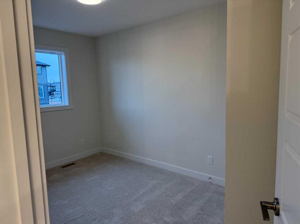 334 Sundown Road, Cochrane, AB - Indoor Photo Showing Other Room