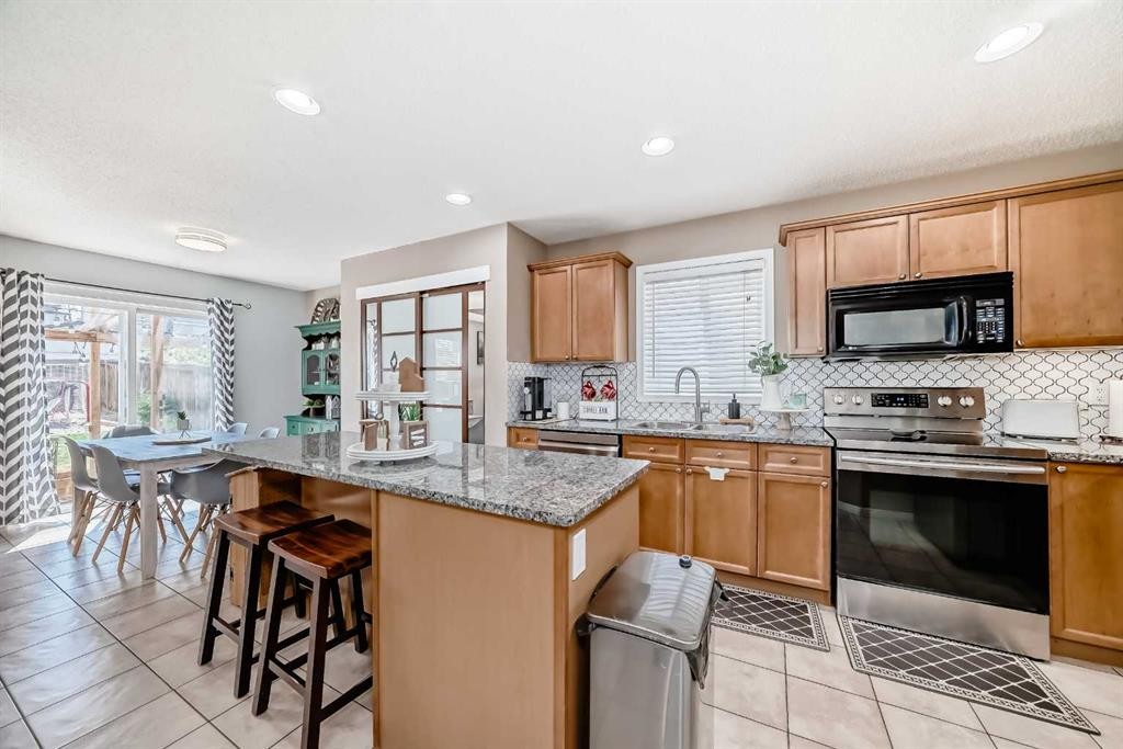 423 Morningside Way Sw, Airdrie, AB - Indoor Photo Showing Kitchen With Double Sink