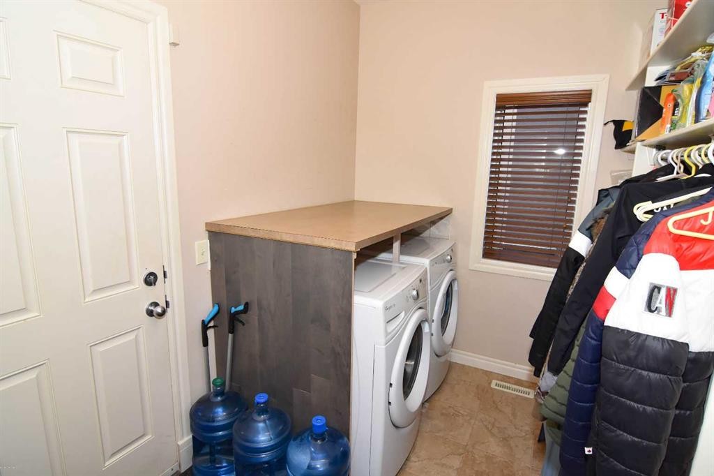 107 Panatella Close Nw, Calgary, AB - Indoor Photo Showing Laundry Room