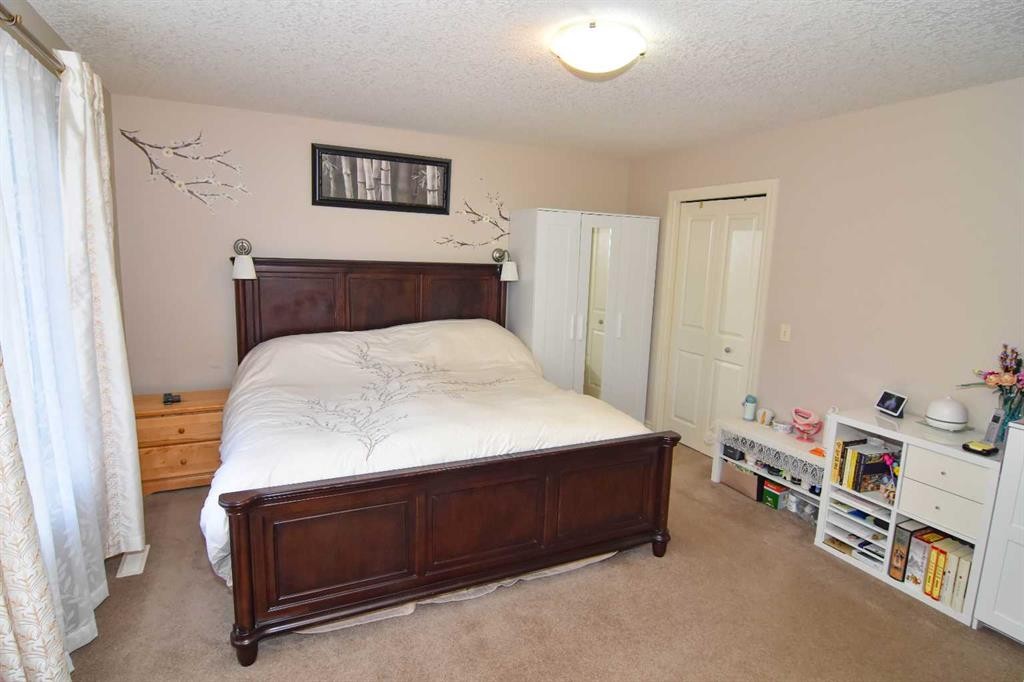 107 Panatella Close Nw, Calgary, AB - Indoor Photo Showing Bedroom