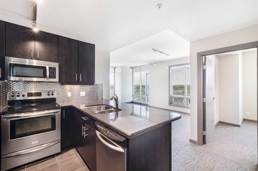 2010-210 15 Avenue Se, Calgary, AB - Indoor Photo Showing Kitchen With Stainless Steel Kitchen With Double Sink With Upgraded Kitchen
