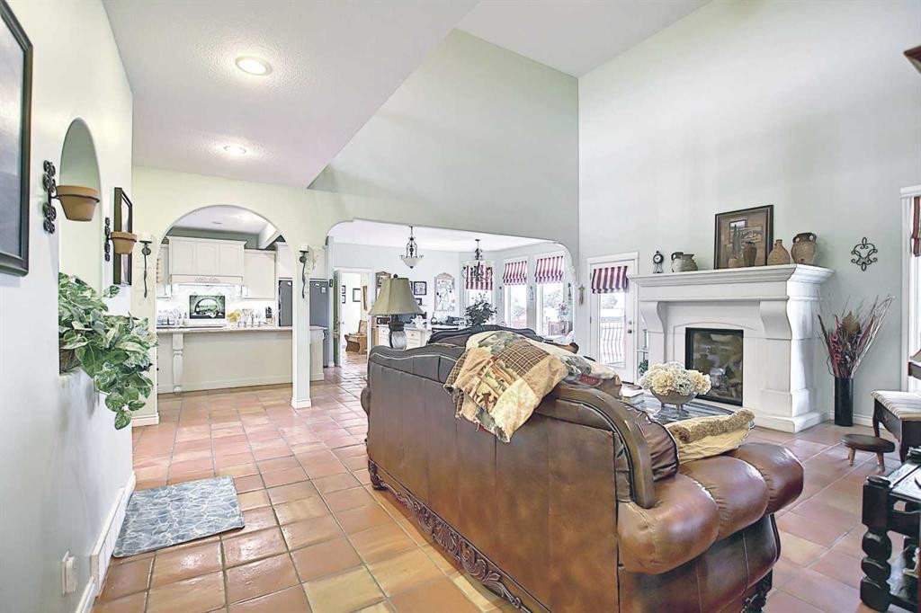 255046 Township Road 250, Rural Wheatland County, AB - Indoor Photo Showing Living Room With Fireplace