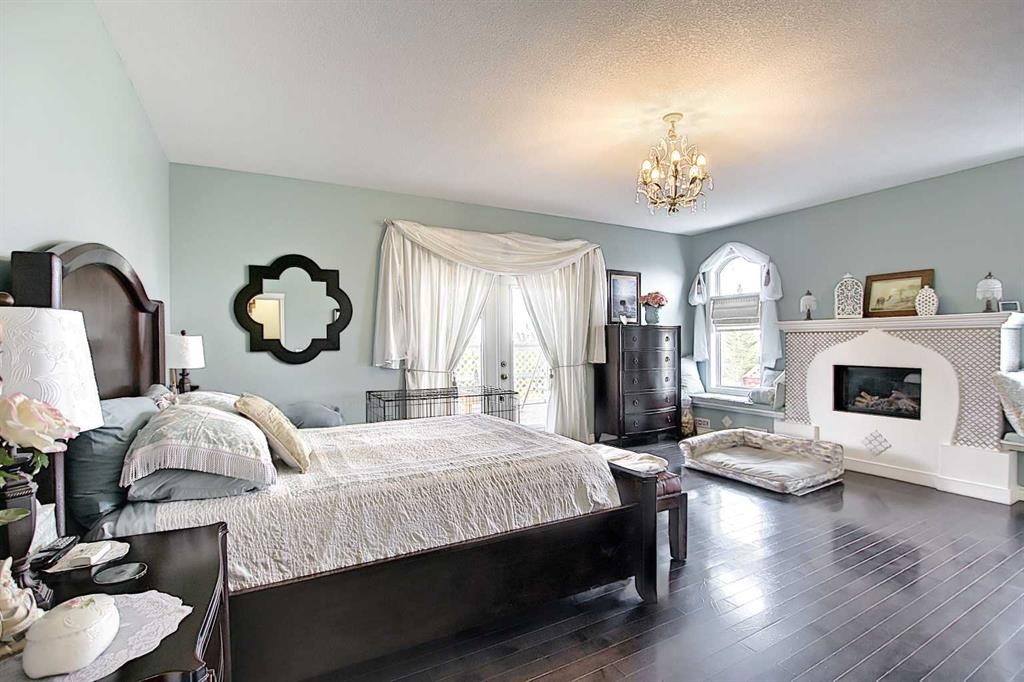 255046 Township Road 250, Rural Wheatland County, AB - Indoor Photo Showing Bedroom With Fireplace