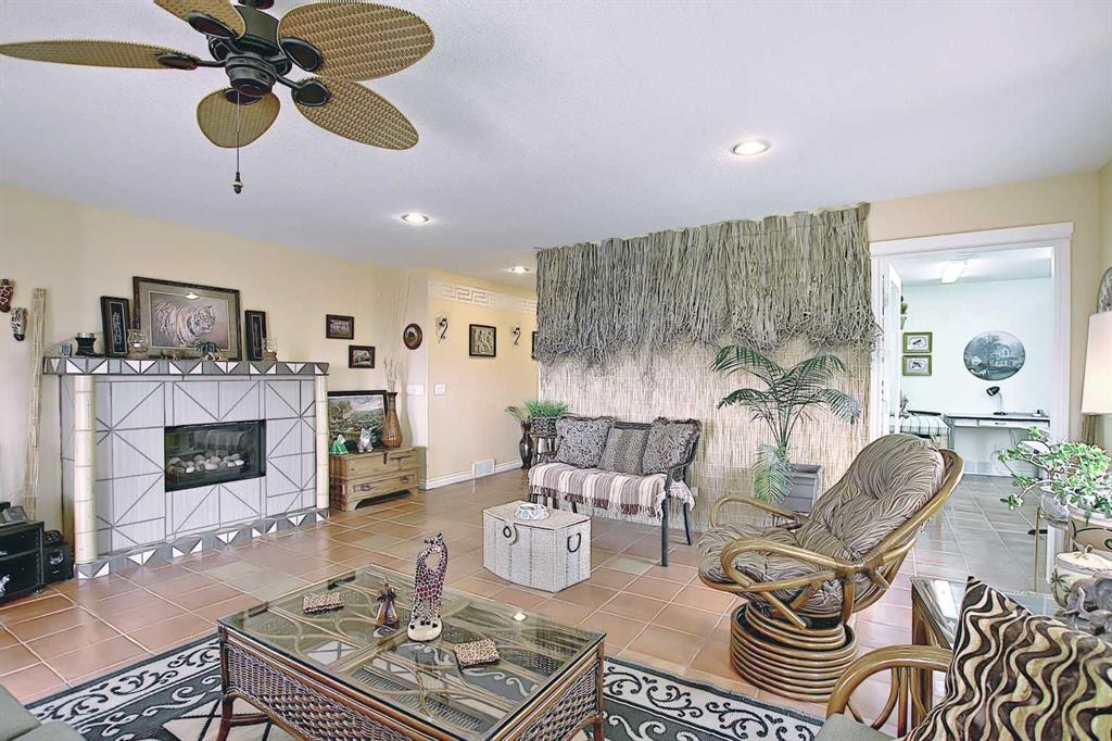 255046 Township Road 250, Rural Wheatland County, AB - Indoor Photo Showing Living Room With Fireplace