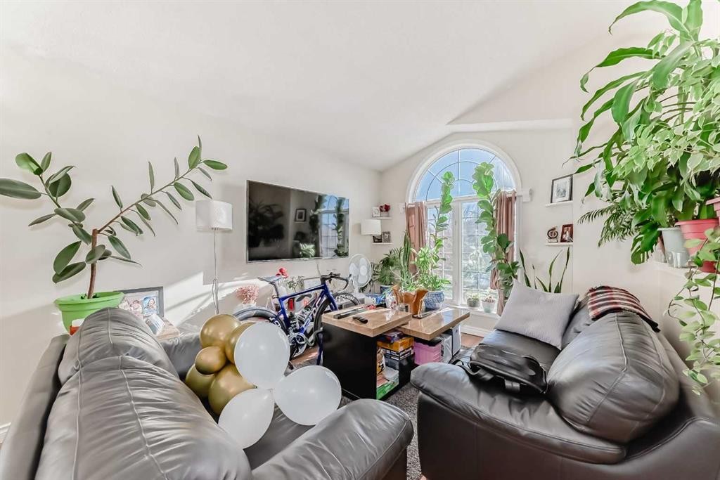 144 Taradale Drive Ne, Calgary, AB - Indoor Photo Showing Living Room