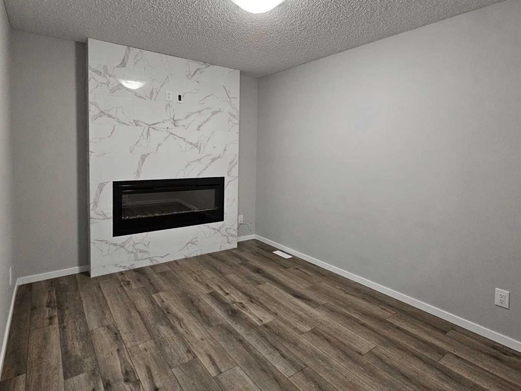 1485 148 Avenue Nw, Calgary, AB - Indoor Photo Showing Other Room With Fireplace