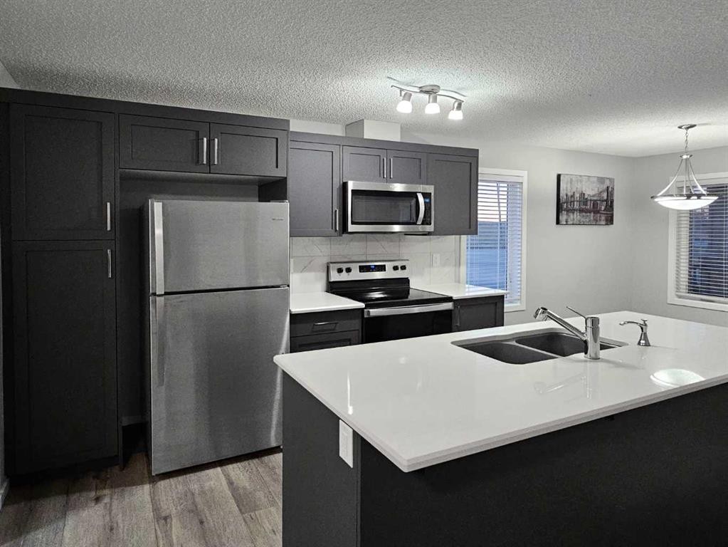 1485 148 Avenue Nw, Calgary, AB - Indoor Photo Showing Kitchen With Stainless Steel Kitchen With Double Sink With Upgraded Kitchen