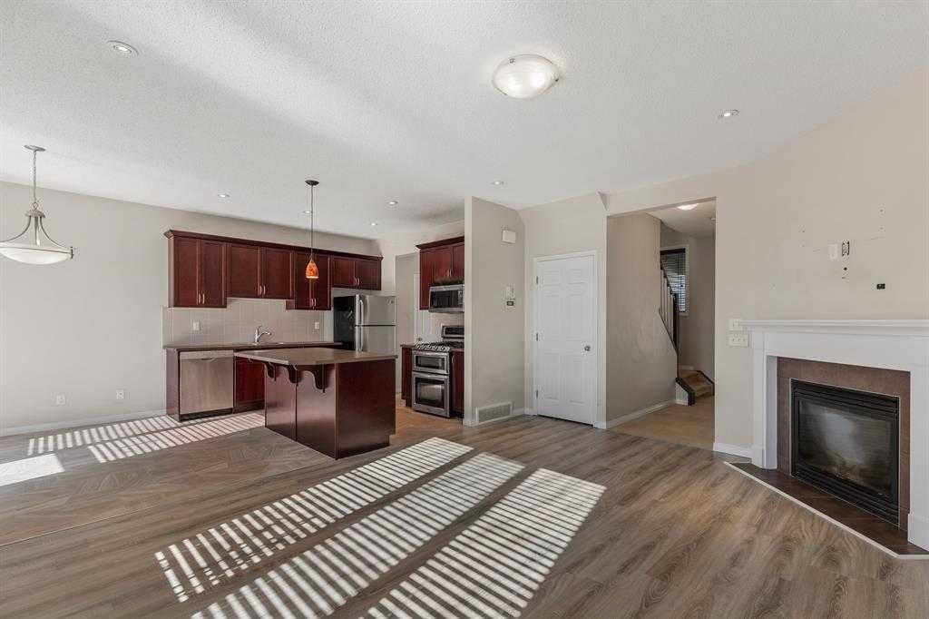 724 Windridge Road Sw, Airdrie, AB - Indoor With Fireplace