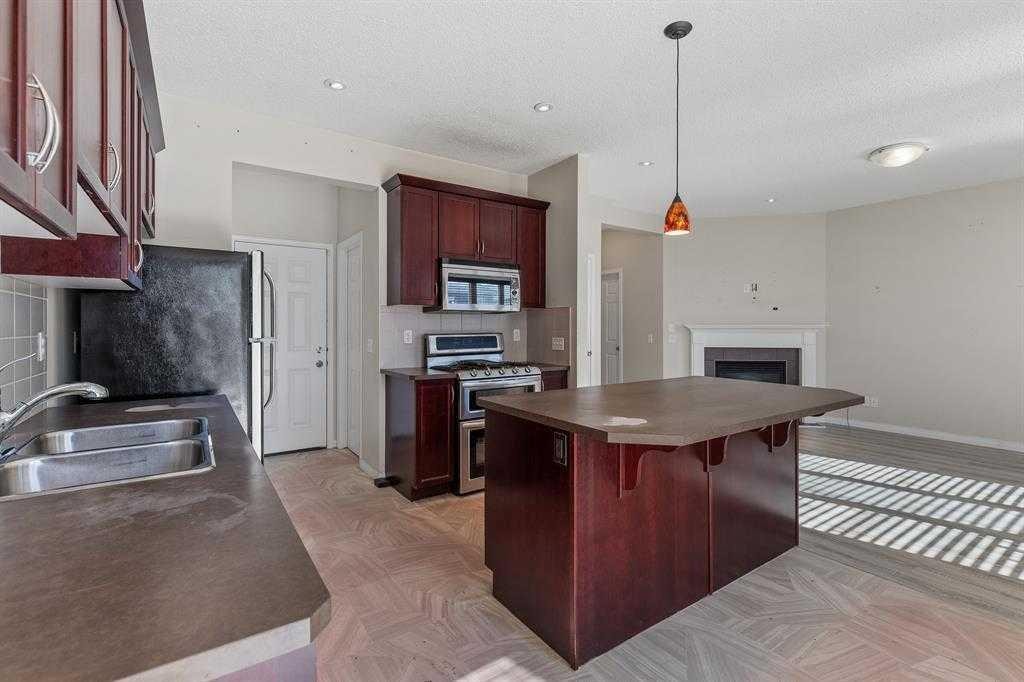 724 Windridge Road Sw, Airdrie, AB - Indoor Photo Showing Kitchen With Double Sink