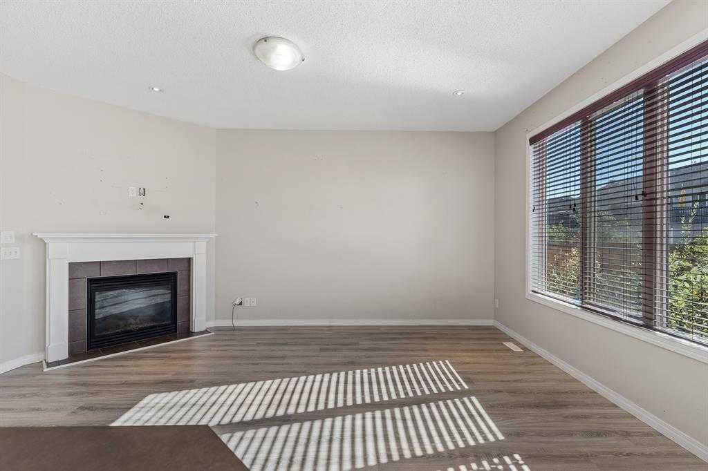 724 Windridge Road Sw, Airdrie, AB - Indoor With Fireplace