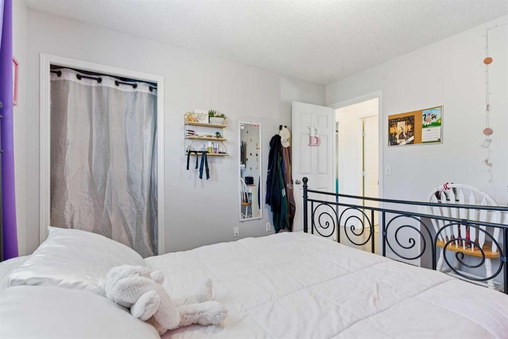 74 Evansbrooke Way Nw, Calgary, AB - Indoor Photo Showing Bedroom