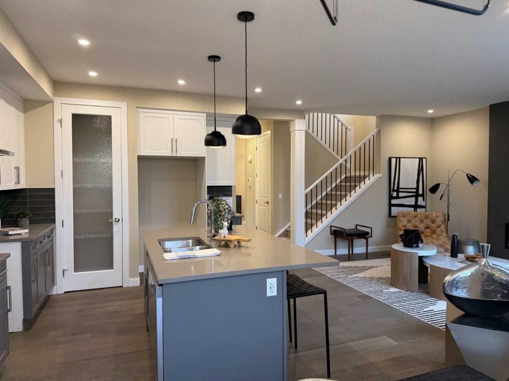 72 Sunrise Heath, Cochrane, AB - Indoor Photo Showing Kitchen With Double Sink