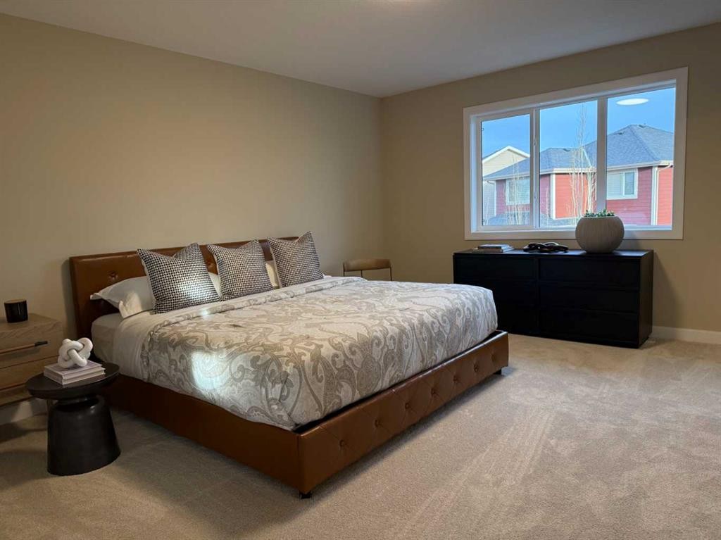 72 Sunrise Heath, Cochrane, AB - Indoor Photo Showing Bedroom