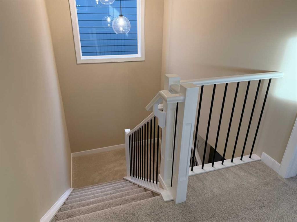 72 Sunrise Heath, Cochrane, AB - Indoor Photo Showing Other Room