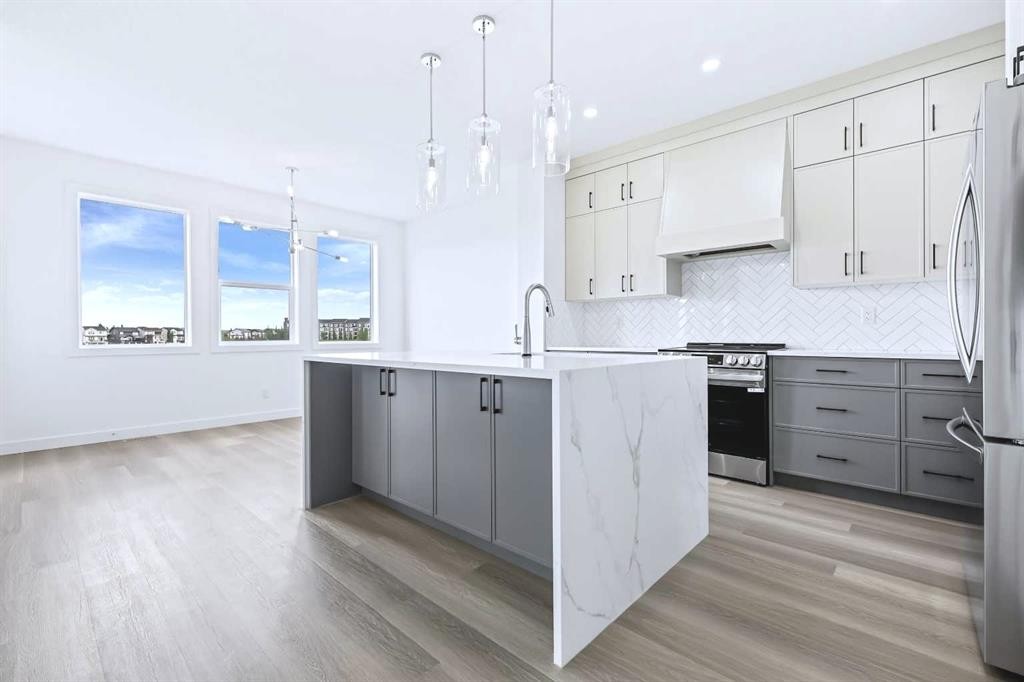 357 Copperhead Way Se, Calgary, AB - Indoor Photo Showing Kitchen With Upgraded Kitchen