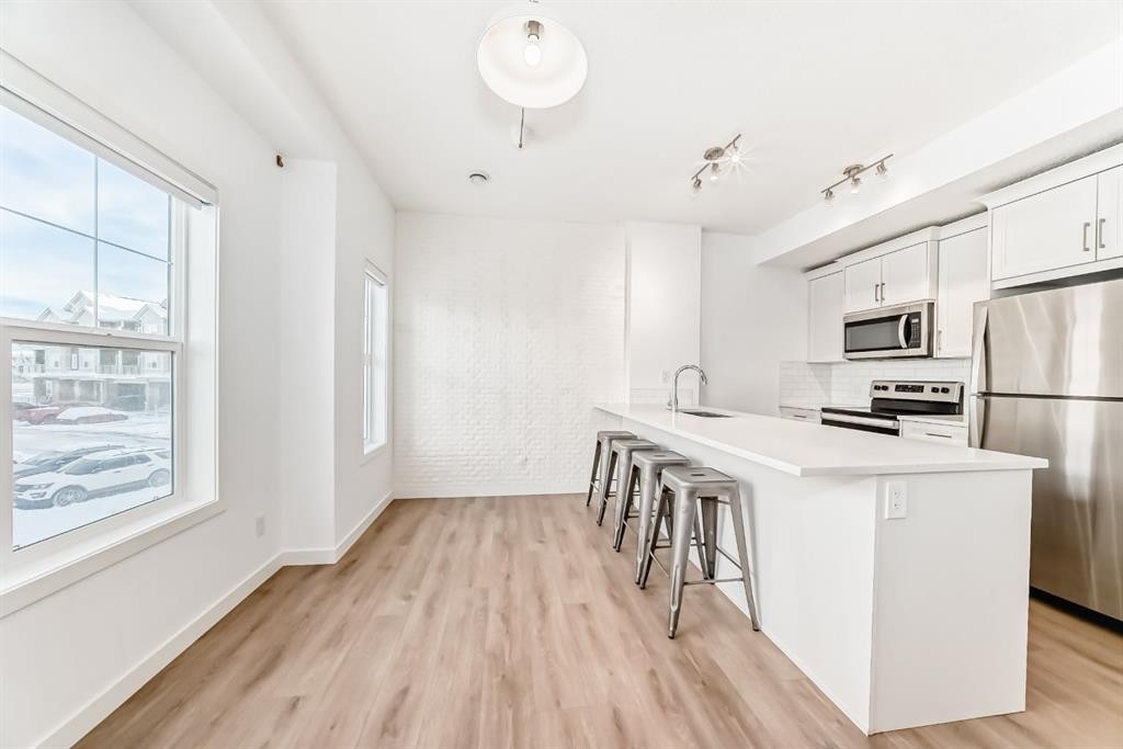 802-250 Fireside View, Cochrane, AB - Indoor Photo Showing Kitchen With Stainless Steel Kitchen