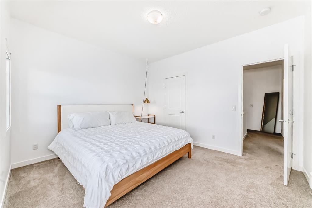 802-250 Fireside View, Cochrane, AB - Indoor Photo Showing Bedroom