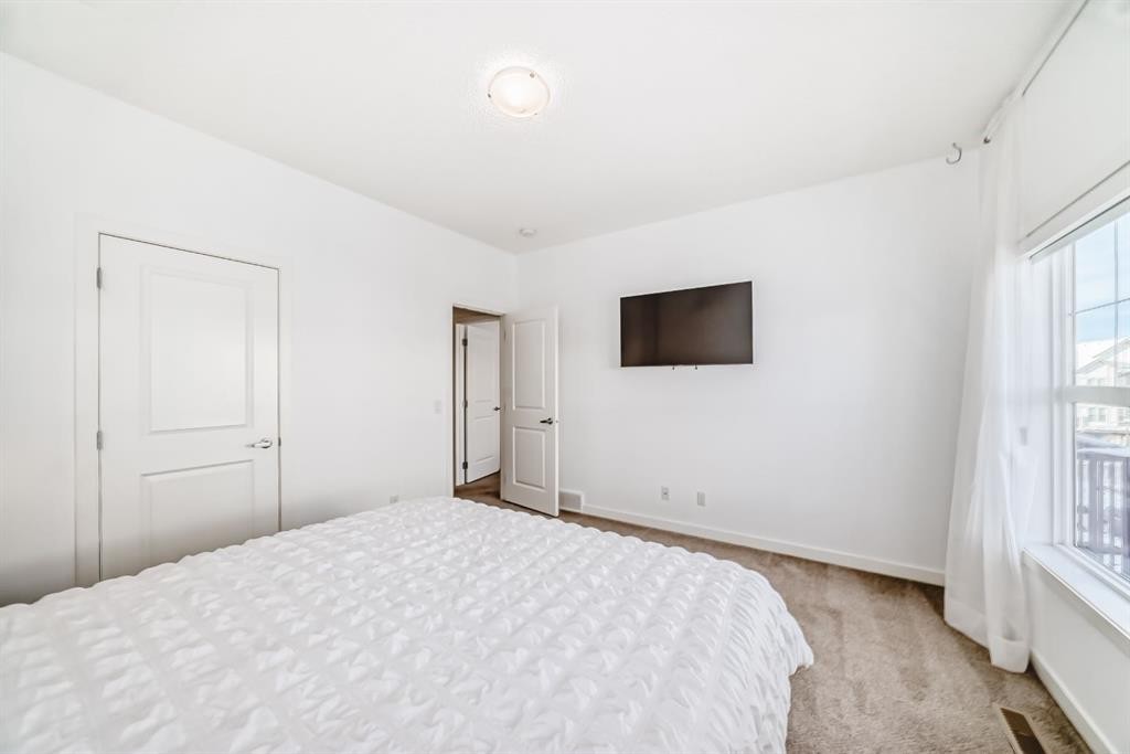 802-250 Fireside View, Cochrane, AB - Indoor Photo Showing Bedroom