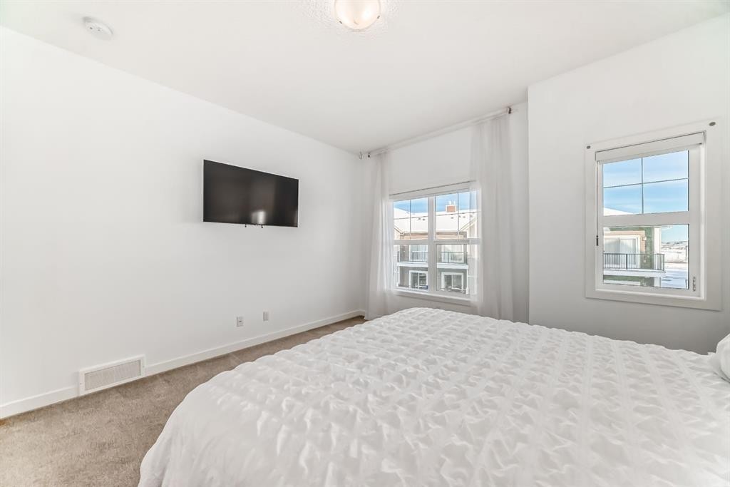 802-250 Fireside View, Cochrane, AB - Indoor Photo Showing Bedroom