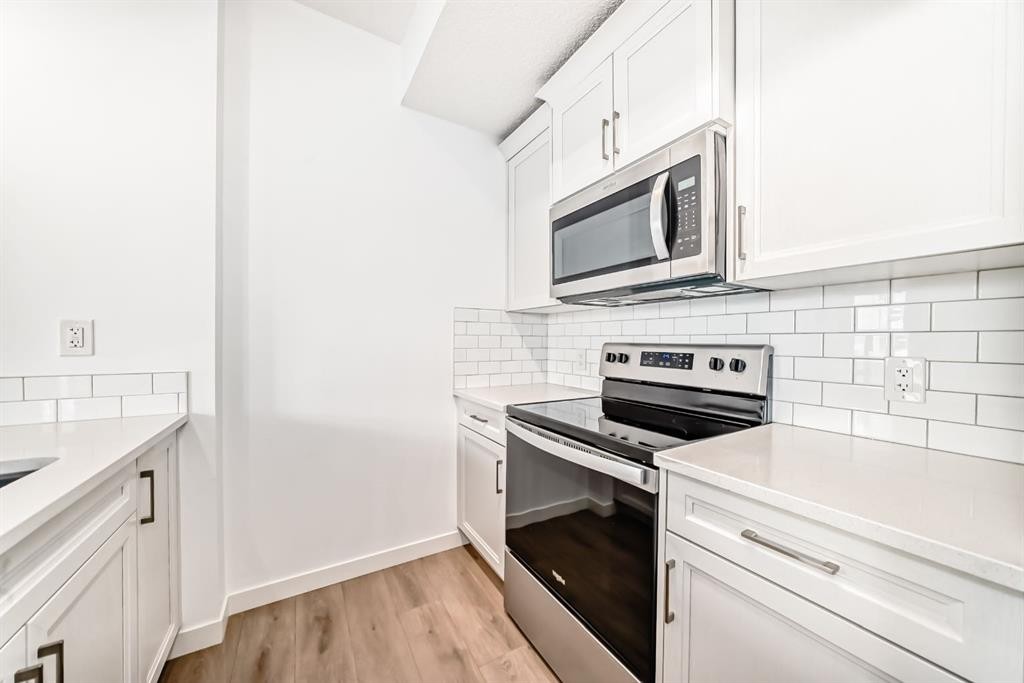 802-250 Fireside View, Cochrane, AB - Indoor Photo Showing Kitchen With Upgraded Kitchen